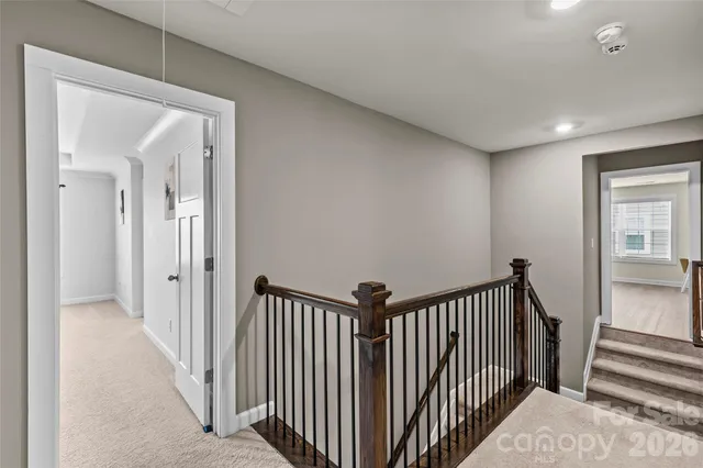 a view of a hallway with a staircase