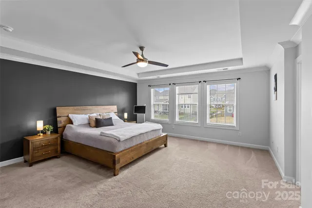 a bedroom with a bed lamp and window