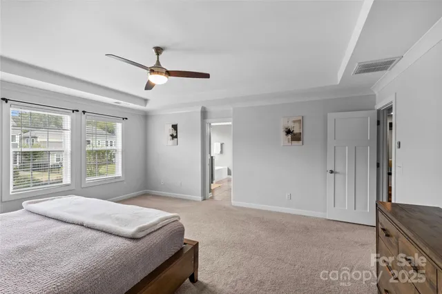 a bedroom with a bed closet and a window