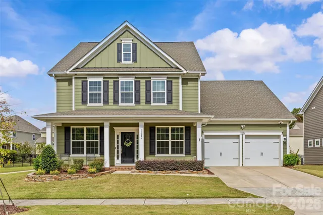 a front view of a building with a yard