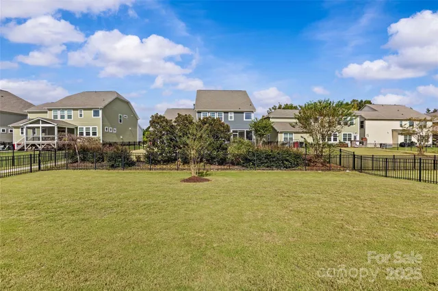a front view of a building with a yard
