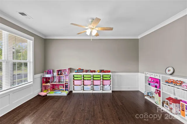 a play room with toys and wooden floor