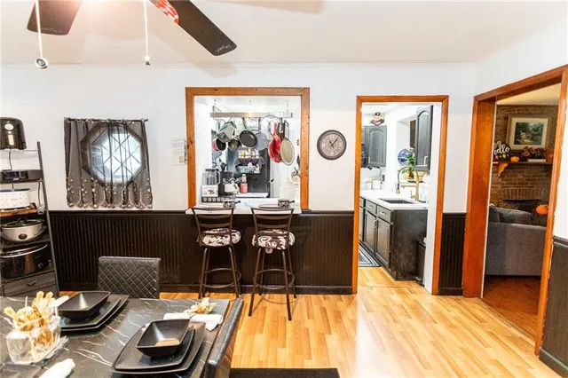 a living room with furniture and painting on the wall
