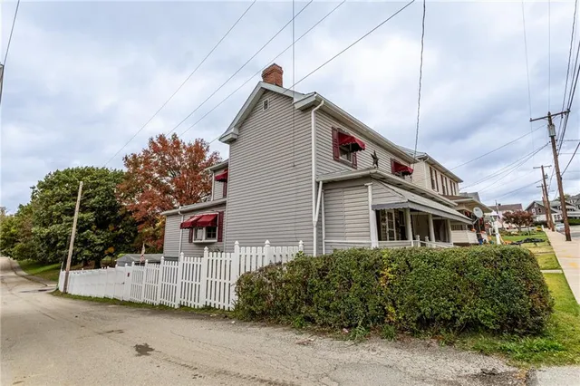a view of a house with a garden