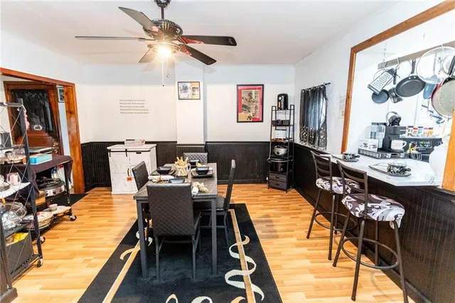 a dining room with furniture and window