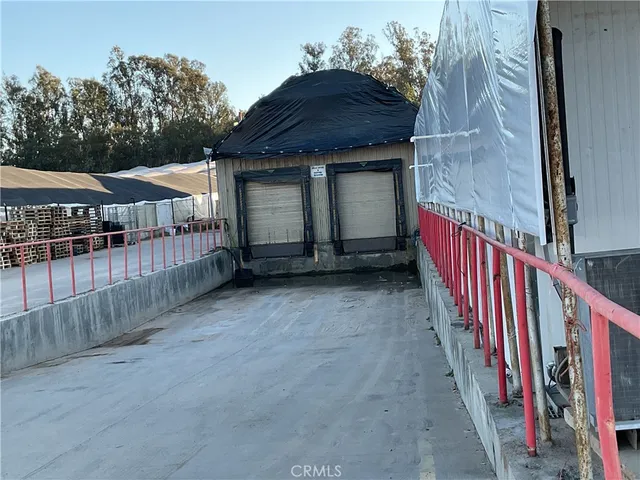 a view of a house with wooden fence