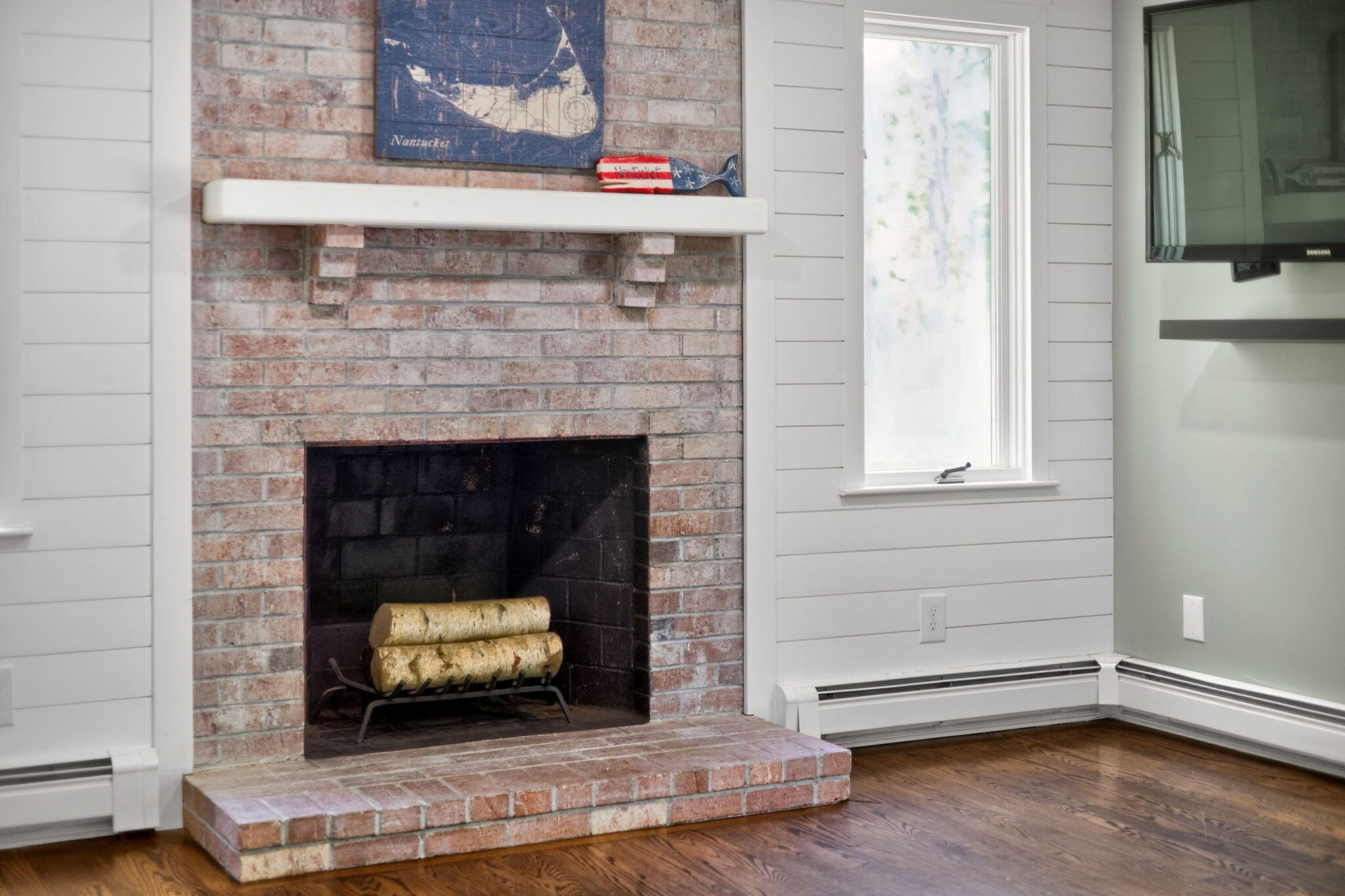 12 Sarah Lawrence Road Sandwich, MA 02563 - Photo 12 of 54 a living room with a fireplace