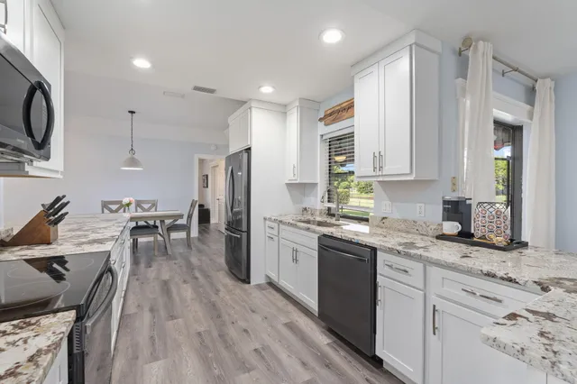 a kitchen with a stove and a microwave