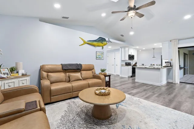 a bedroom with bed and wooden floor