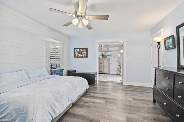 a view of a hallway with wooden shelves