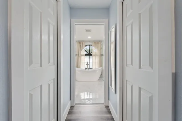 a bathroom with a sink a mirror and a bathtub