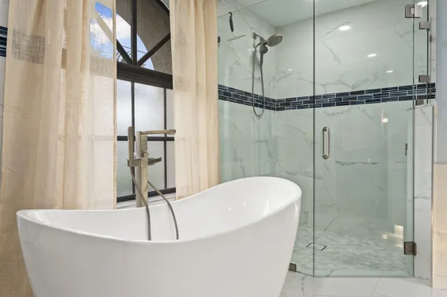 a bathroom with a shower and a shower head