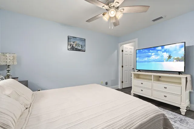 a bathroom with a double vanity sink mirror and toilet