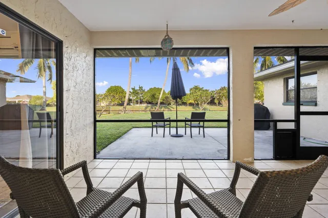 a view of a livingroom with furniture and a window