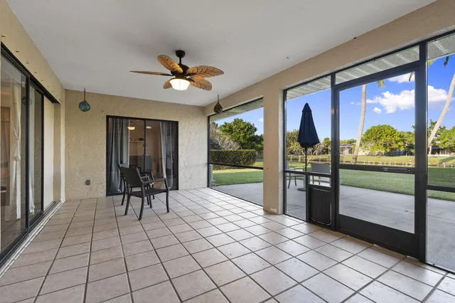 a view of a chairs and table in backyard
