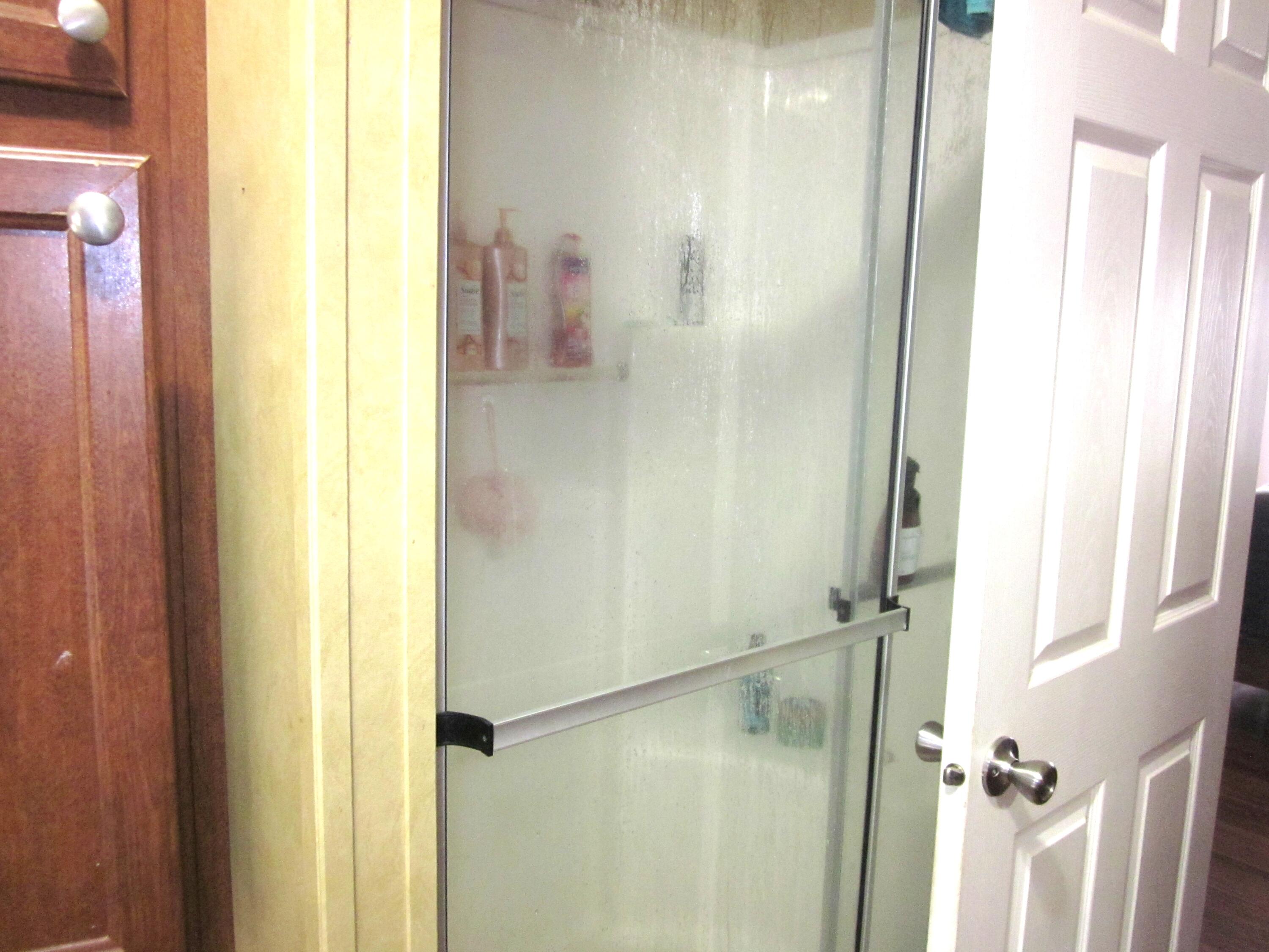 177 Carolina Road Rocky Mount, VA 24151 - Photo 15 of 24 a bathroom with a glass shower door