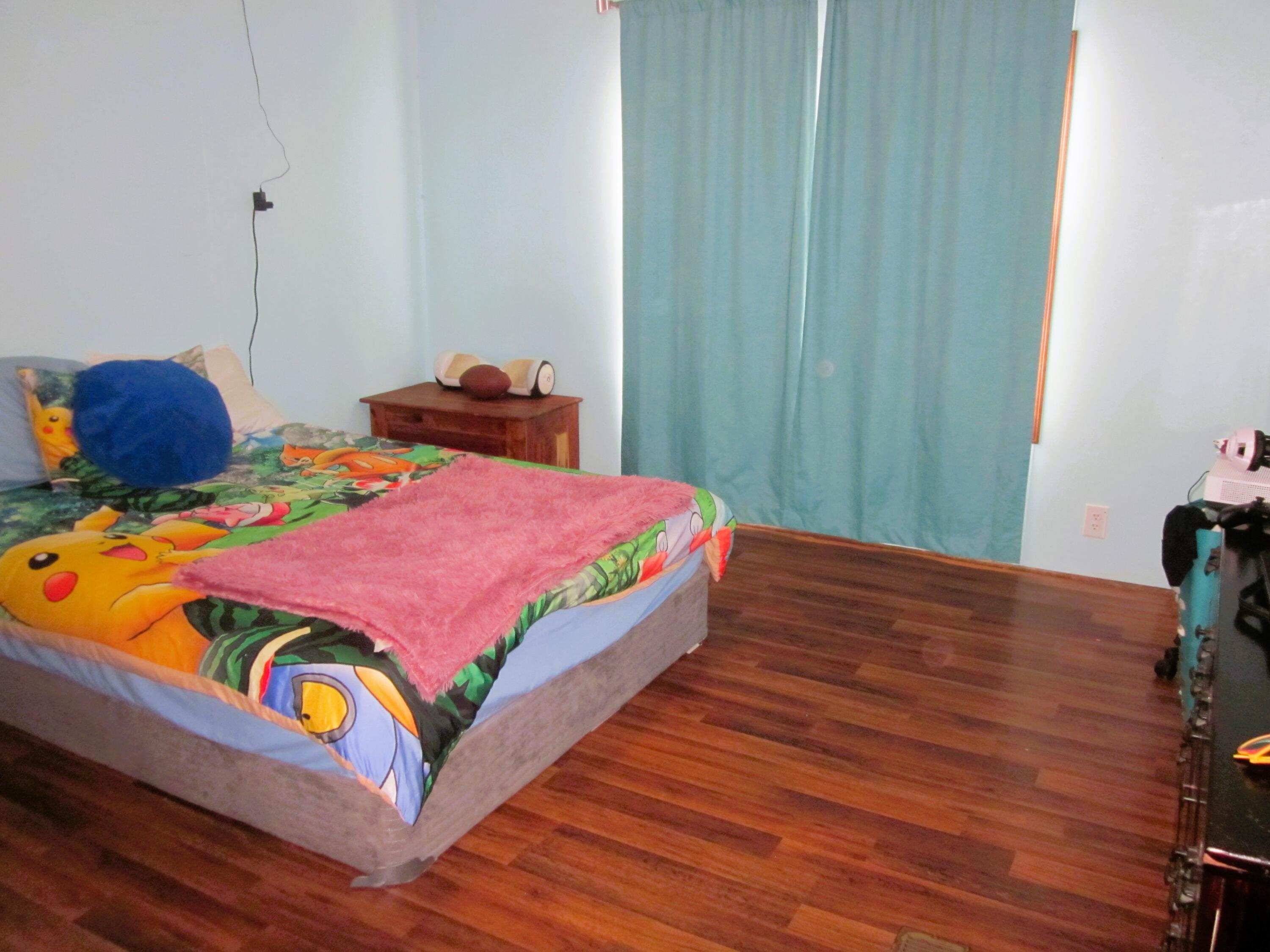 177 Carolina Road Rocky Mount, VA 24151 - Photo 18 of 24 a bedroom with bed and wooden floor