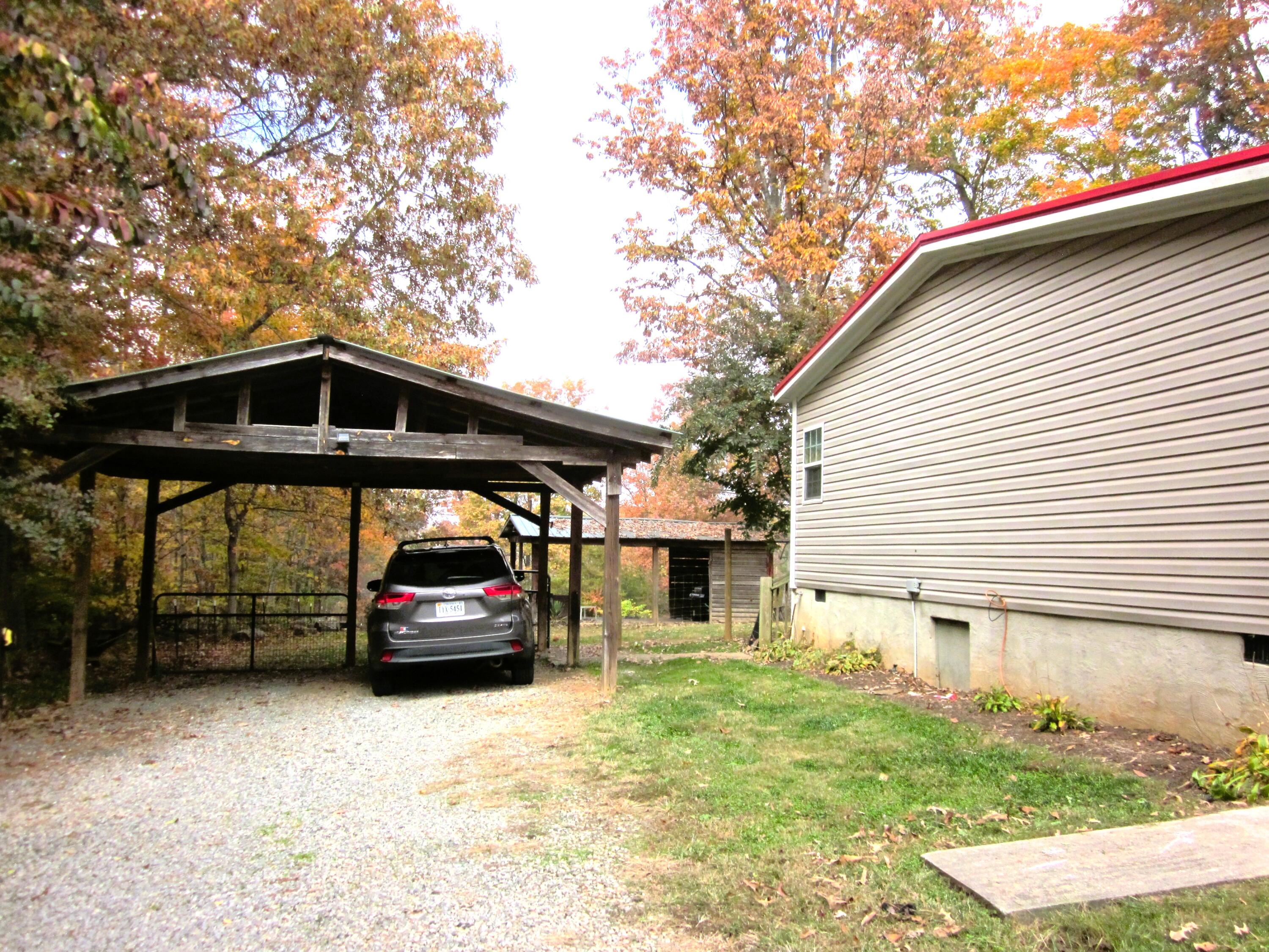 177 Carolina Road Rocky Mount, VA 24151 - Photo 4 of 24 a car parked in front of a house