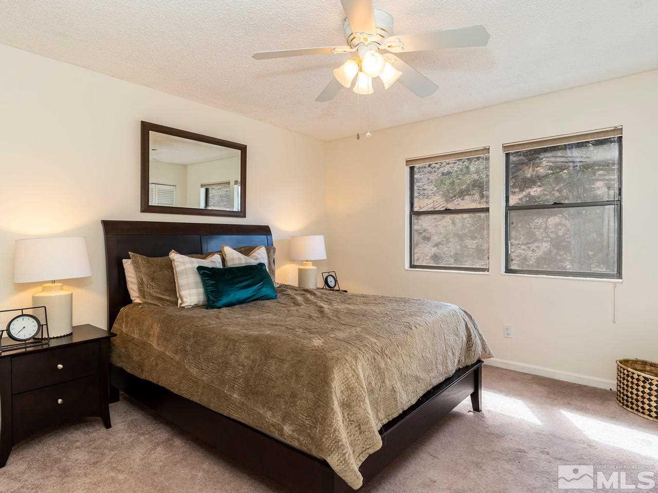 2075 Heatheridge Lane Reno, NV 89509 - Photo 17 of 25 a bedroom with a bed and a window