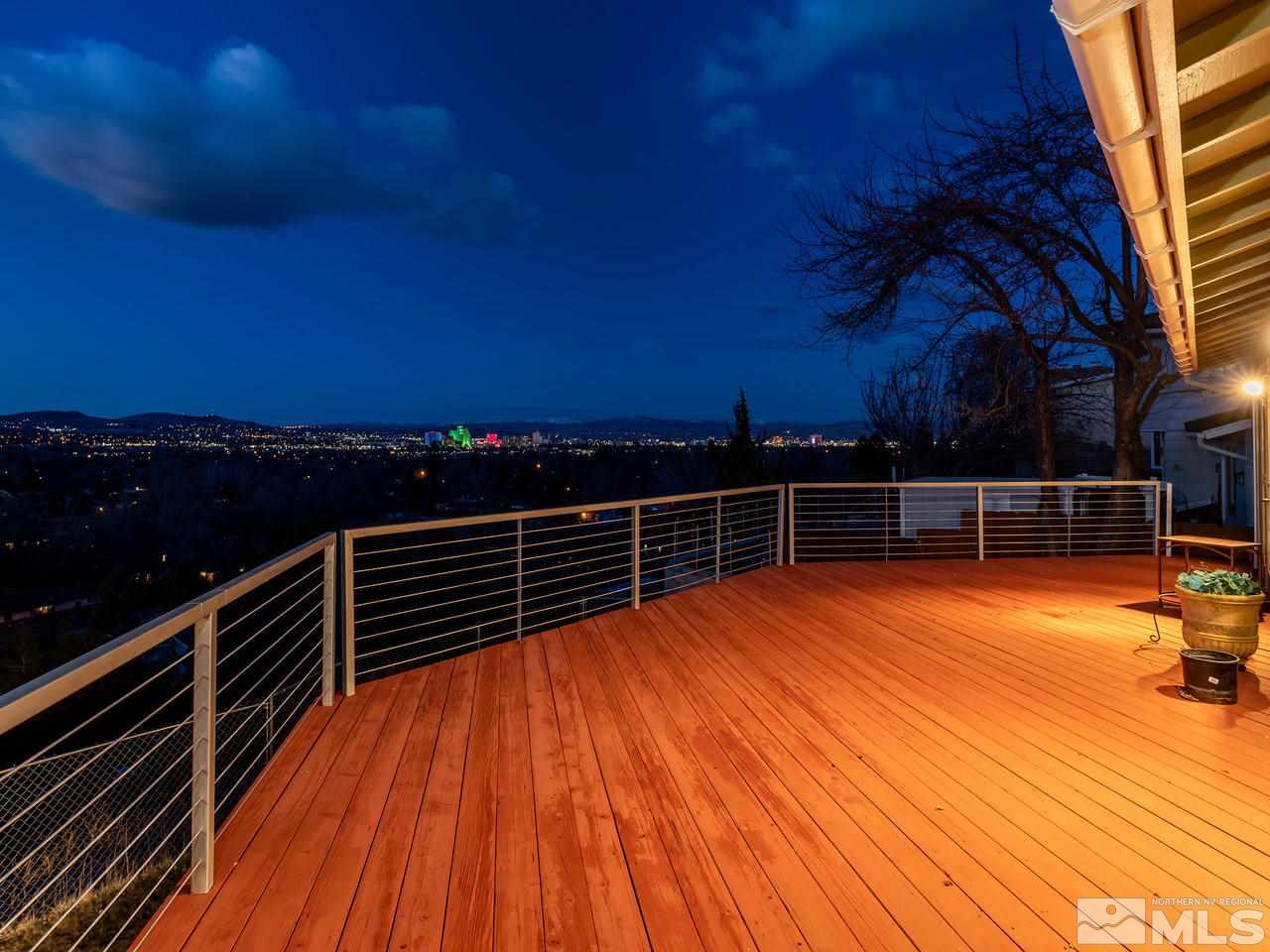 2075 Heatheridge Lane Reno, NV 89509 - Photo 4 of 25 a view of a balcony with wooden floor and city view