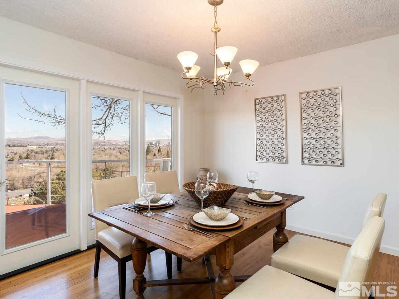 2075 Heatheridge Lane Reno, NV 89509 - Photo 10 of 25 a view of a dining room with furniture wooden floor and chandelier
