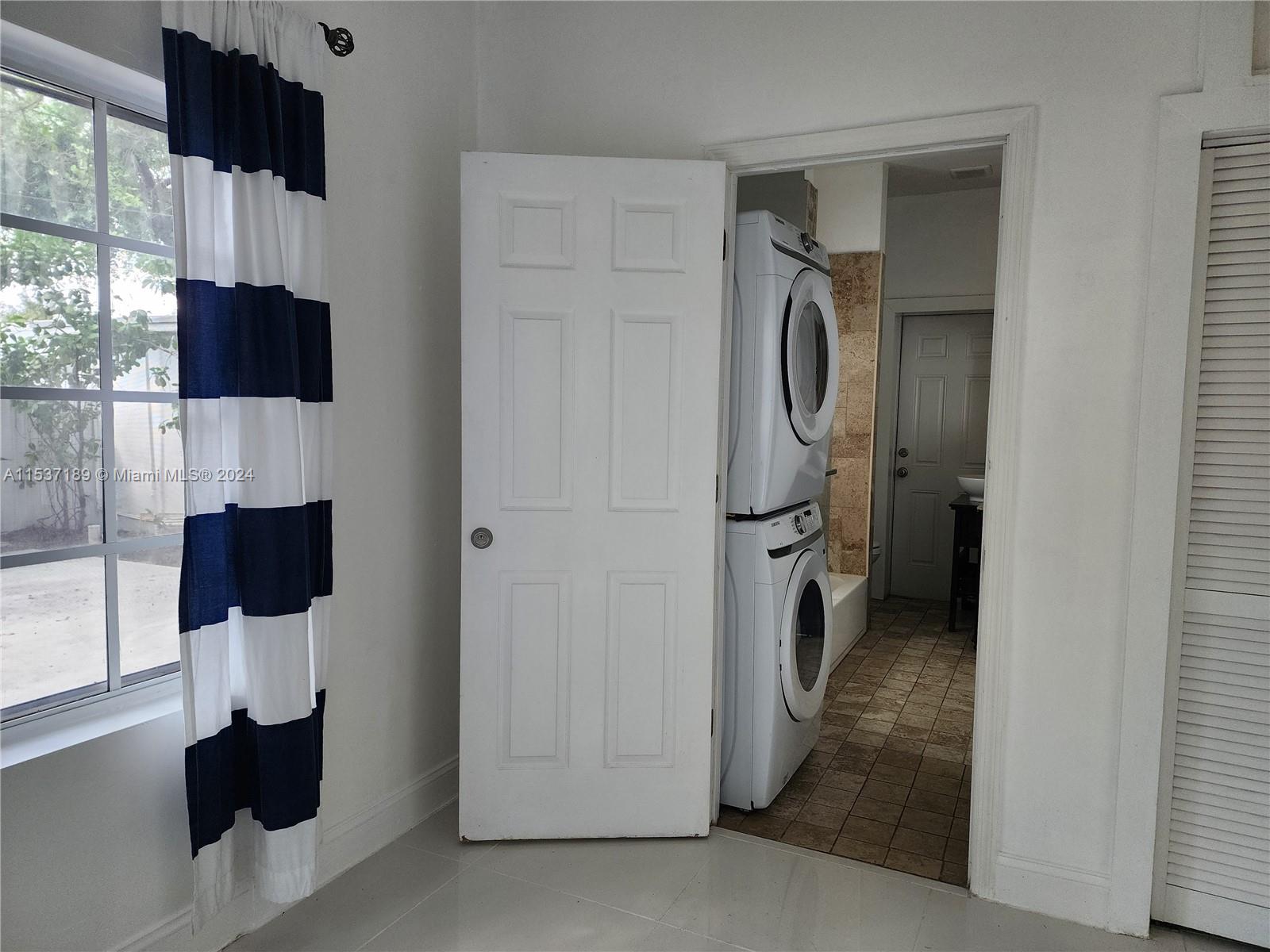 Buena Vista Miami, FL 33127 - Photo 12 of 19 a bathroom with a toilet a sink and mirror