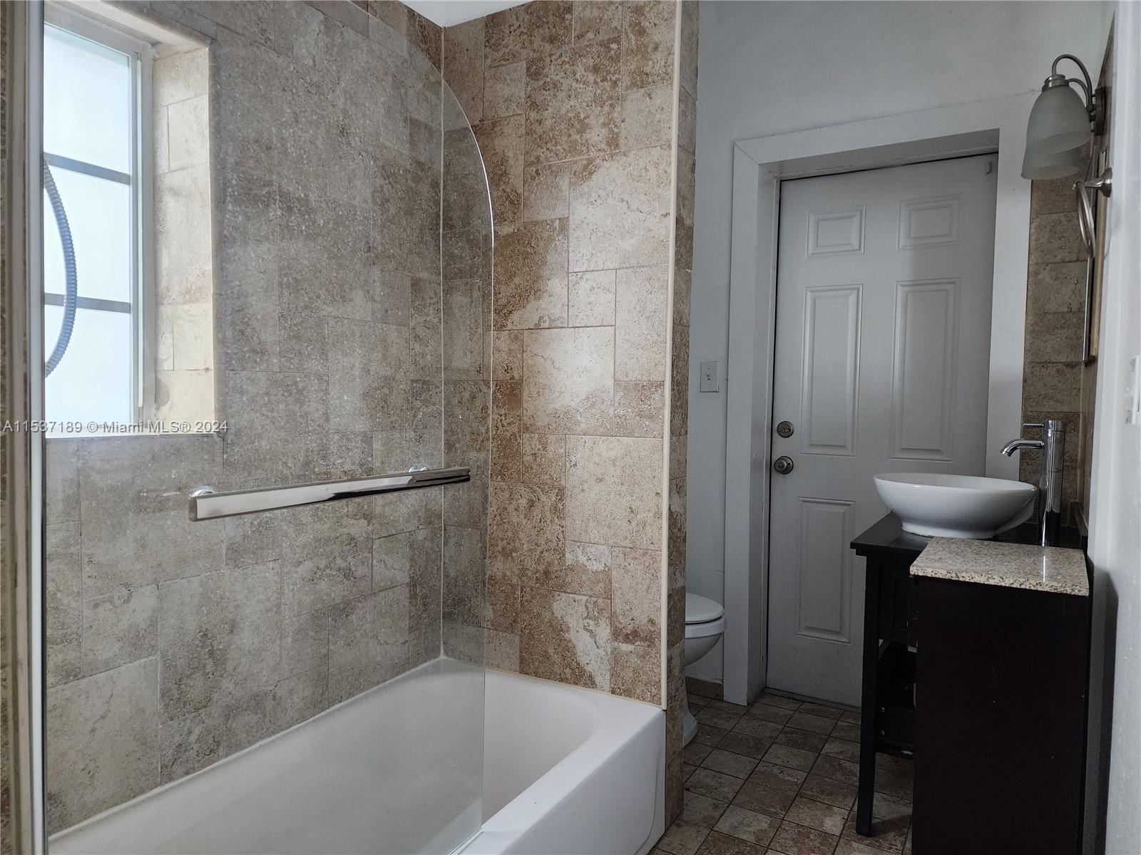 Buena Vista Miami, FL 33127 - Photo 13 of 19 a bathroom with a tub and a sink