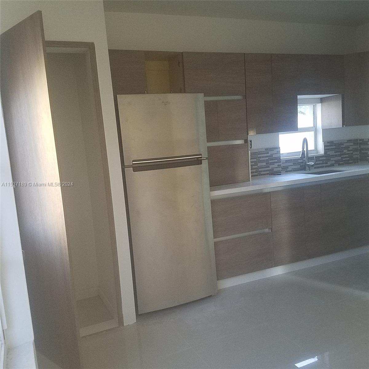 Buena Vista Miami, FL 33127 - Photo 15 of 19 a view of walk in closet with empty racks