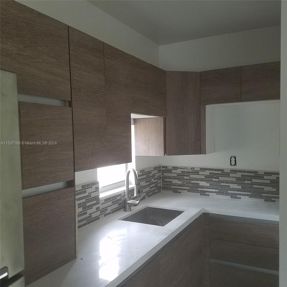 Buena Vista Miami, FL 33127 - Photo 16 of 19 a bathroom with a sink and a mirror