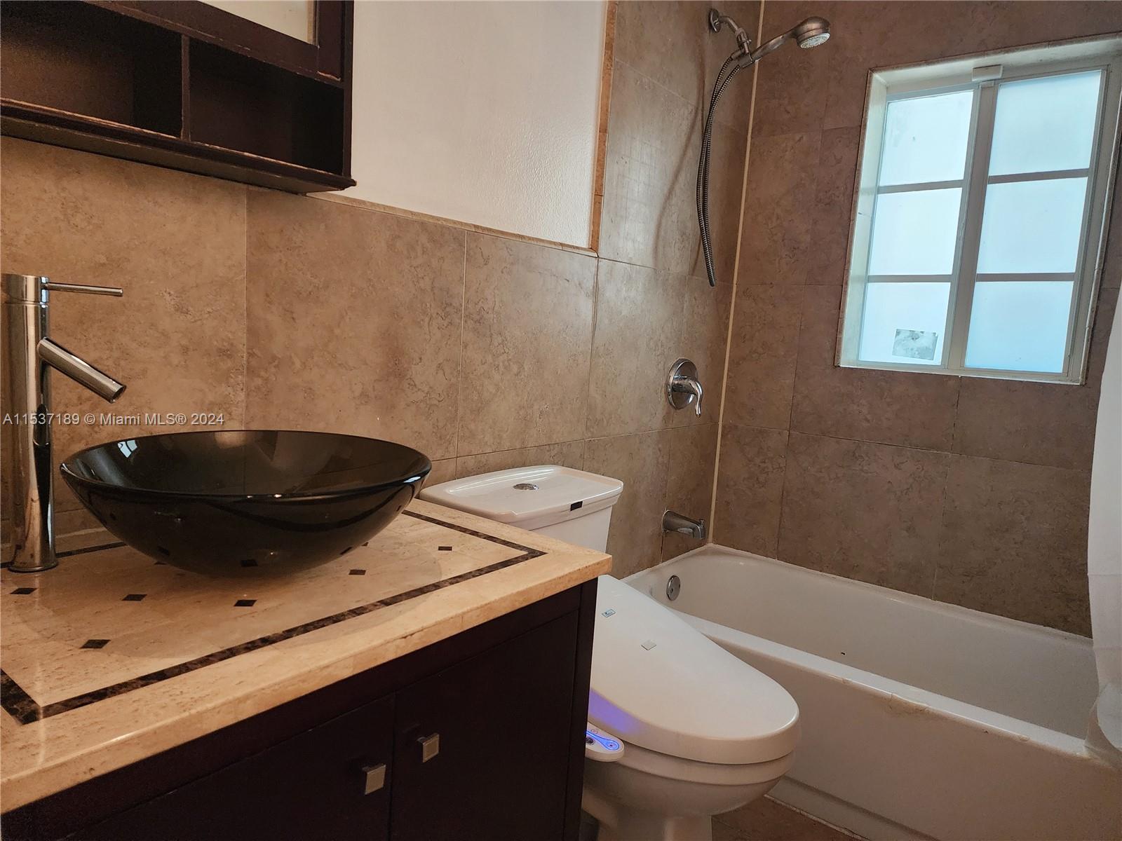 Buena Vista Miami, FL 33127 - Photo 10 of 19 a bathroom with a sink a toilet and bathtub