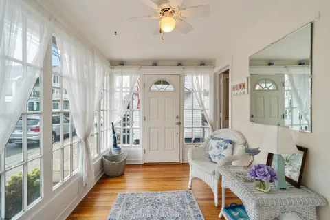 a living room with furniture and a window