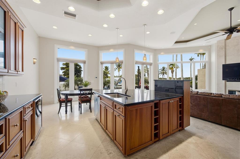 761 Norton Street Longboat Key, FL 34228 - Photo 21 of 66 a kitchen with stainless steel appliances granite countertop a stove and a refrigerator