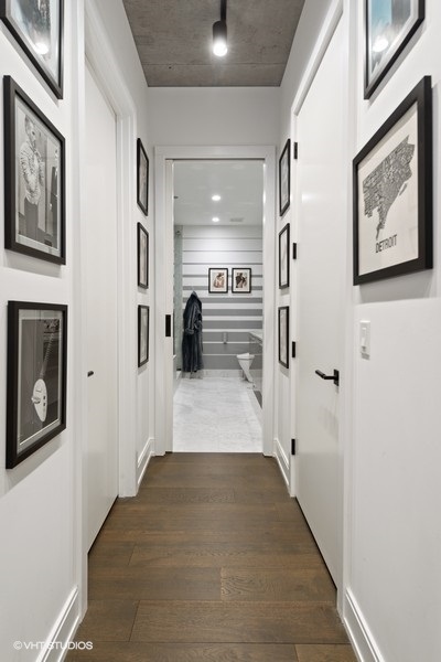 111 South Peoria Street, Unit 506 Chicago, IL 60607 - Photo 20 of 24 a view of a hallway with wooden floor and staircase