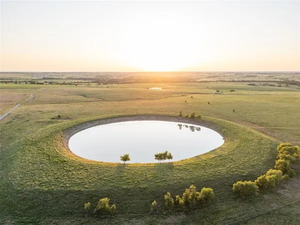 a view of a lake with a big yard