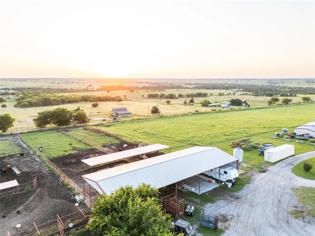 an aerial view of a city with an ocean
