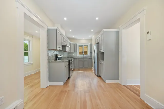 a view of kitchen with wooden floor