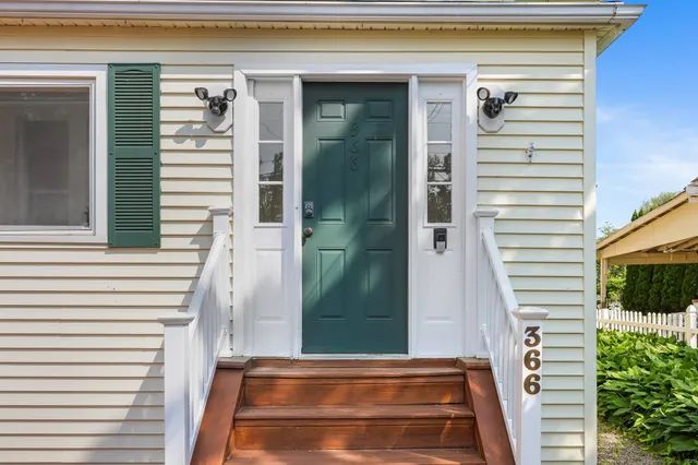 a front view of a house with a garage