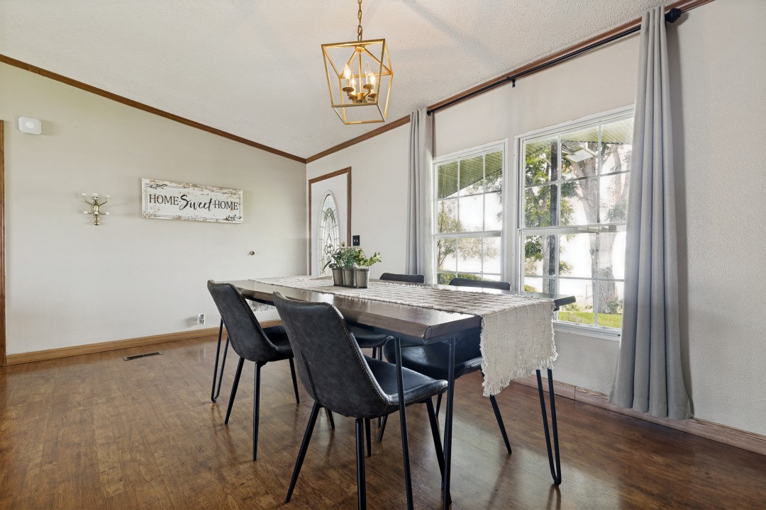 207 Vivian Road Onalaska, TX 77360 - Photo 15 of 34 a view of a dining room with furniture window and wooden floor
