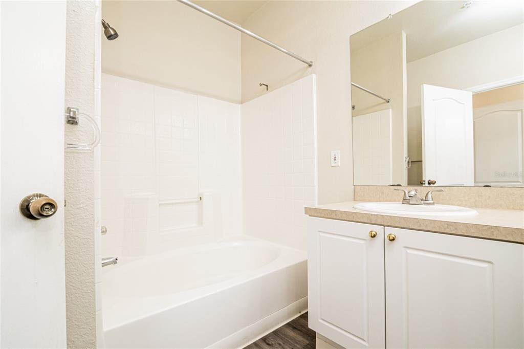 3391 South Kirkman Road, Unit 1216 Orlando, FL 32811 - Photo 21 of 33 a bathroom with a sink and a mirror