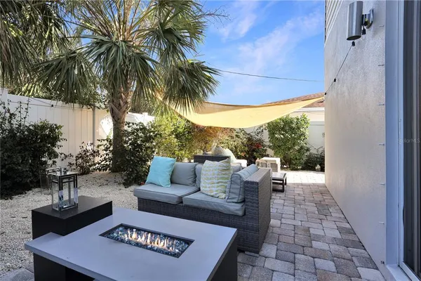 a view of a patio with couches and potted plants
