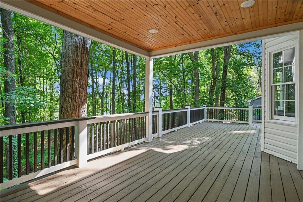 1040 Auburn Road Dacula, GA 30019 - Photo 5 of 42 a view of a wooden deck