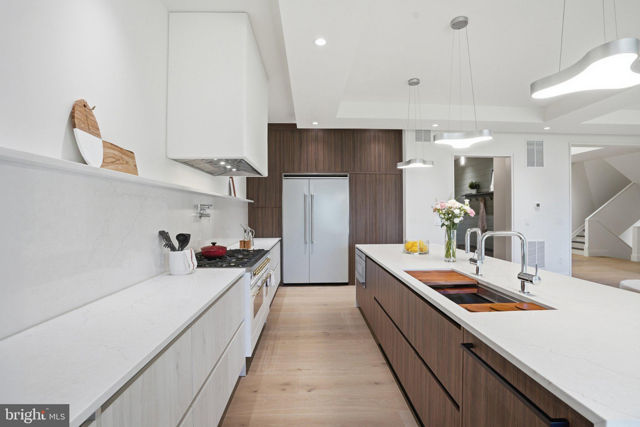 7421 Magarity Road Falls Church, VA 22043 - Photo 28 of 66 Sleek modern kitchen with elegant finishes.