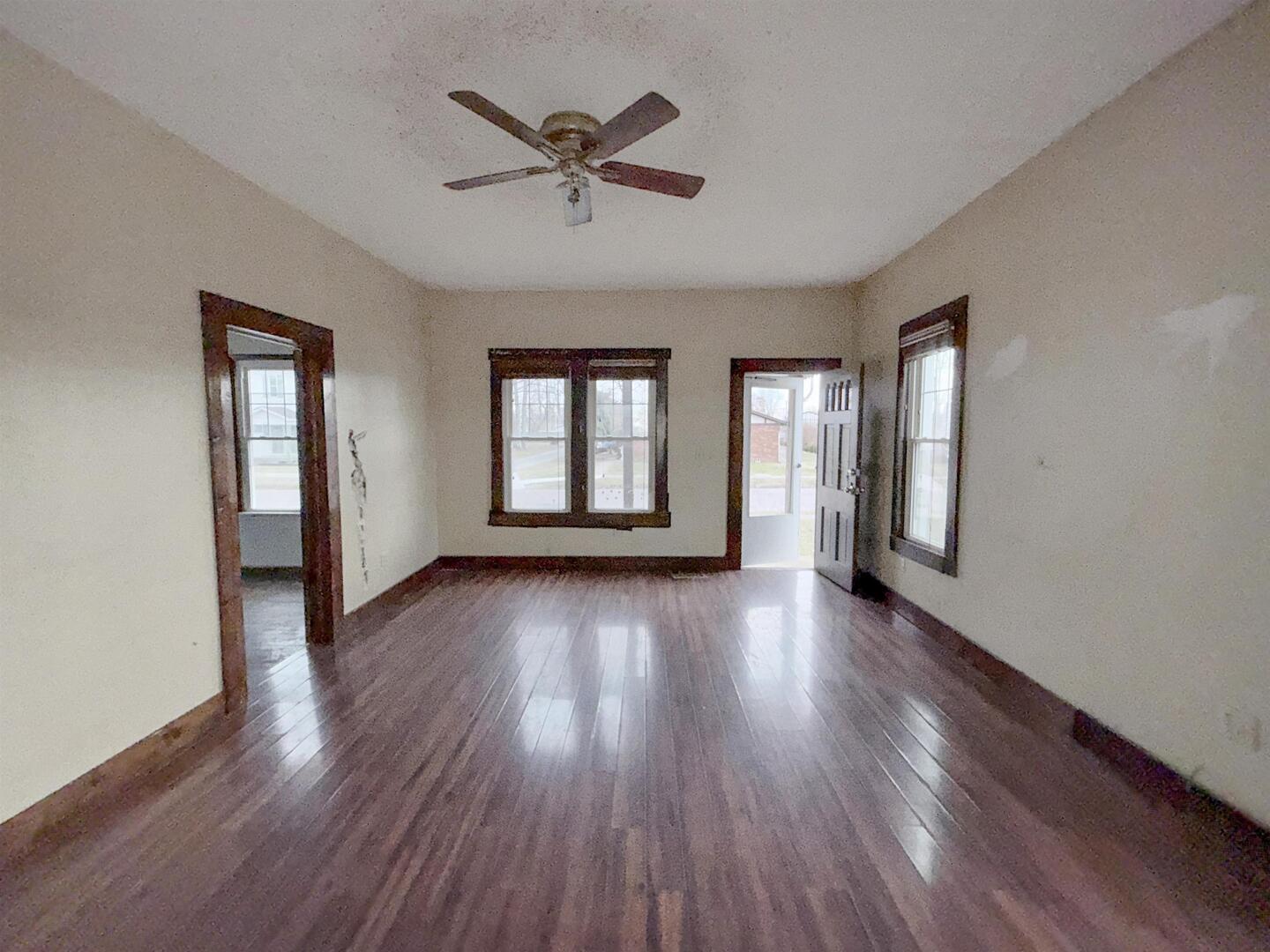 220 South 14th Street Murphysboro, IL 62966 - Photo 2 of 11 a view of empty room with wooden floor and fan