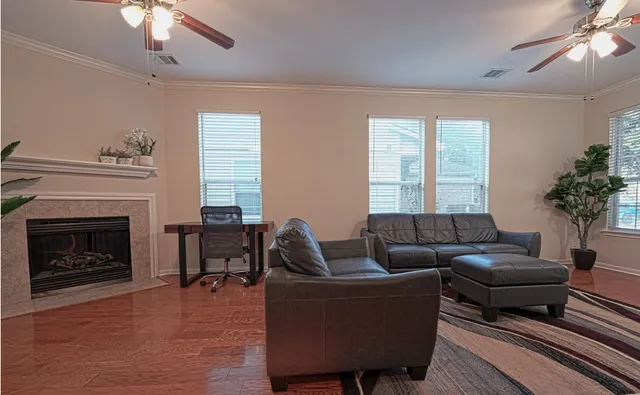 a living room with furniture and a fireplace