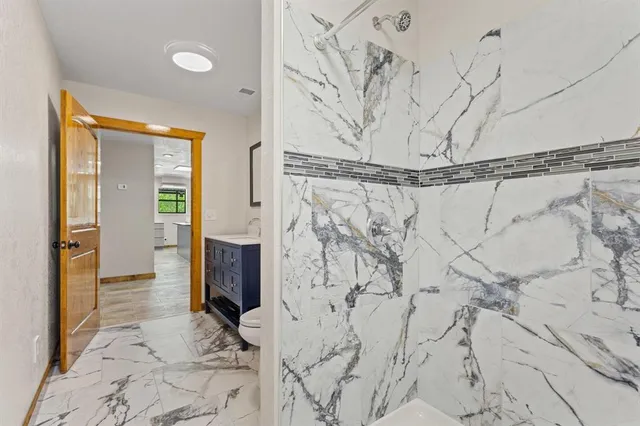 a bathroom with a bathtub and shower