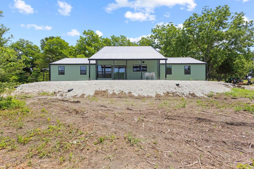 516 County Road Honey Grove, TX 75446 - Photo 19 of 27 a front view of a house with a yard