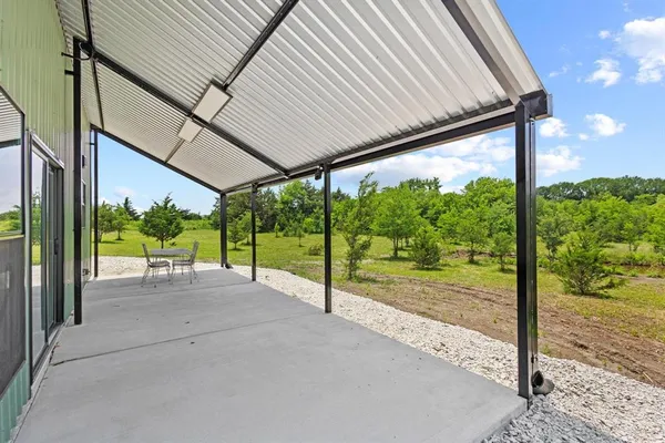 a view of a room with porch and wooden floor