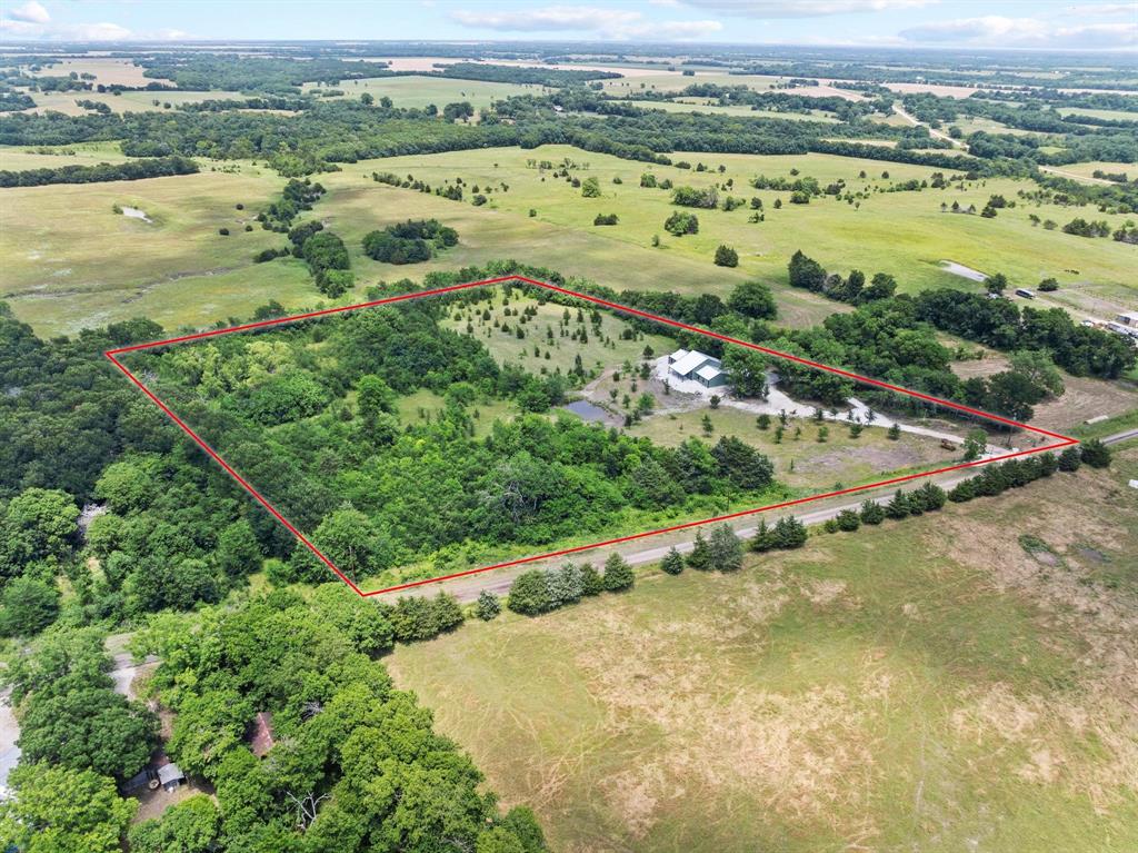 516 County Road Honey Grove, TX 75446 - Photo 2 of 27 an aerial view of a city