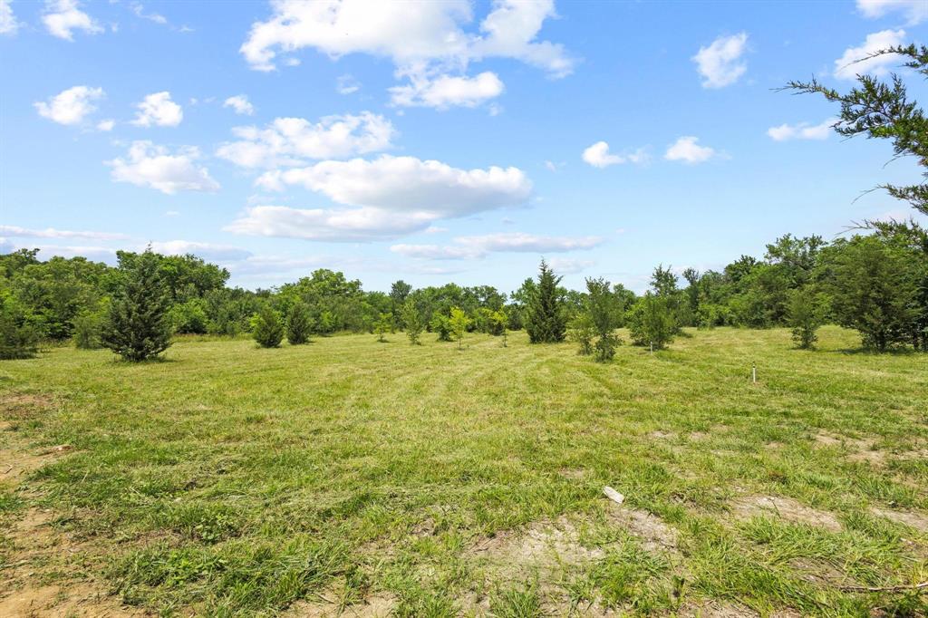 516 County Road Honey Grove, TX 75446 - Photo 24 of 27 a view of an ocean and a yard