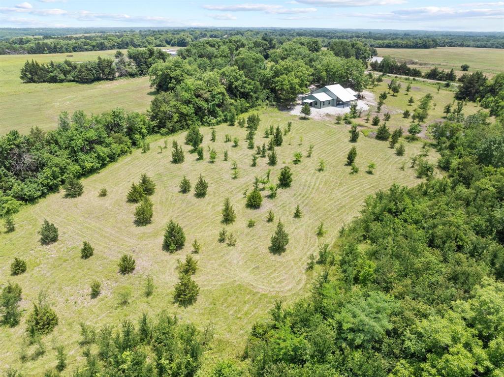 516 County Road Honey Grove, TX 75446 - Photo 26 of 27 a view of a lake with a mountain view